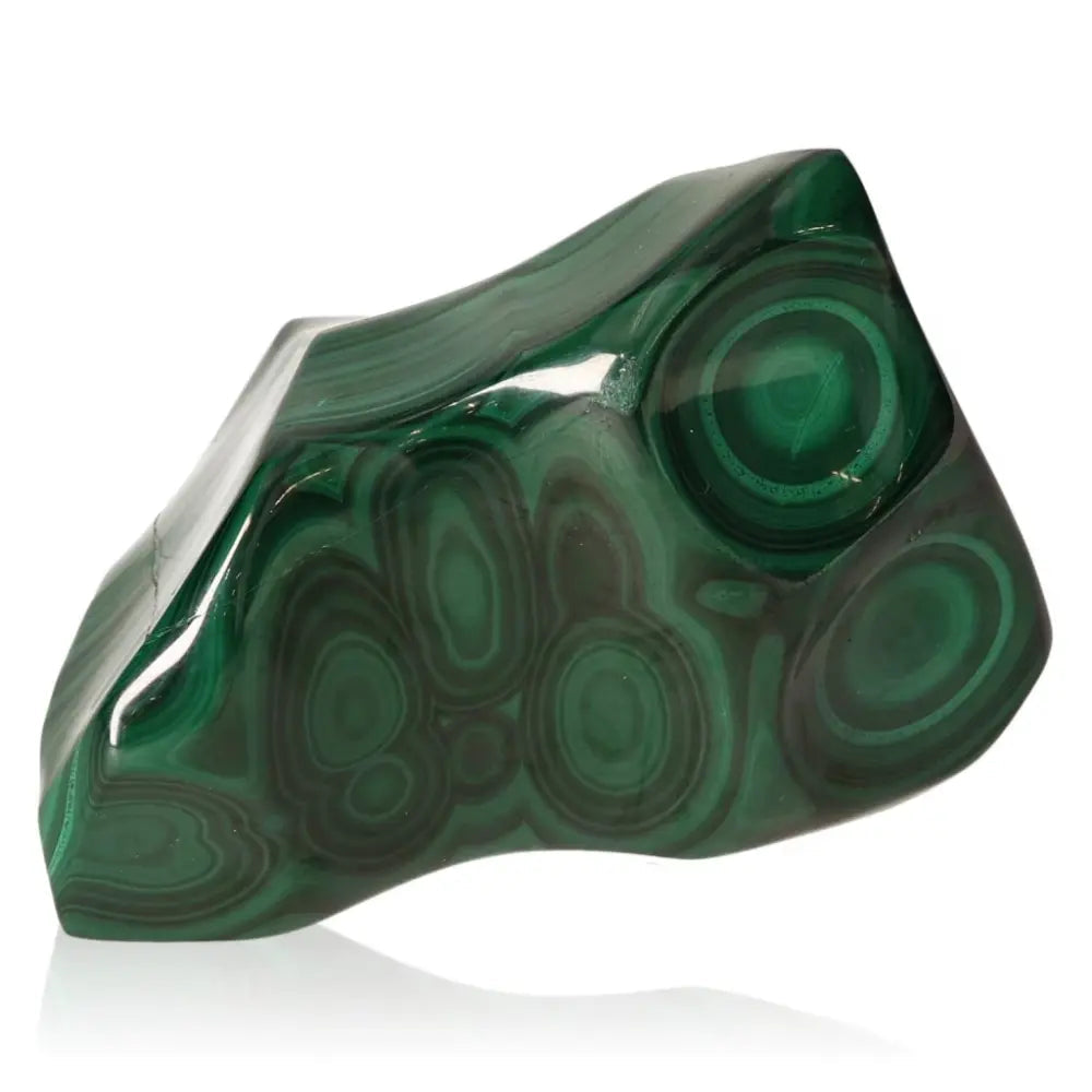 Polished malachite stone showcasing vibrant green swirls, known for its natural beauty and spiritual benefits.