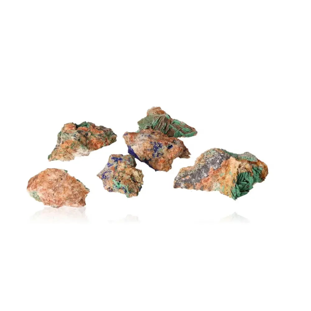 Raw malachite stones with vibrant green patterns, showcasing nature's unique beauty and the gemstone's calming energy attributes.