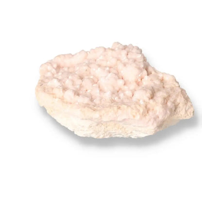 Soft pink Manganocalcite crystal from Sylvia Crystals, known as the 'Stone of Love' for emotional healing and spiritual elegance.