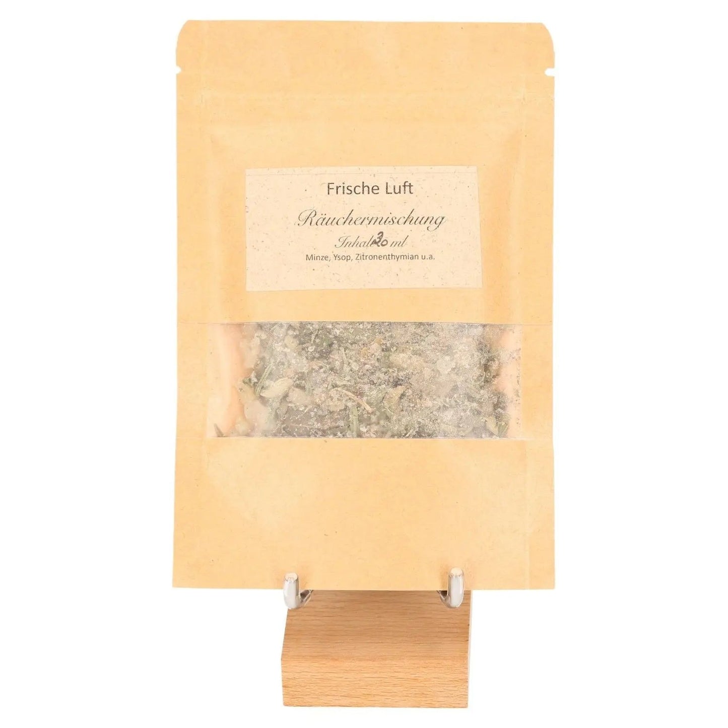 Incense blend package labeled 'Frische Luft' displayed on a wooden stand, featuring herbs like Moroccan mint and eucalyptus for fresh air effect.