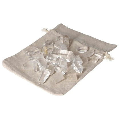 Mini Point Clear Quartz stones in a beige bag, offering powerful purification and harmonizing energy. Ideal for dispelling negativity.