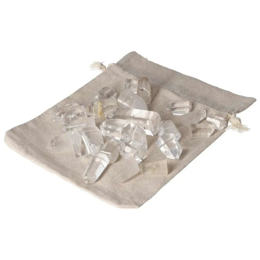 Mini Point Clear Quartz stones in a beige bag, offering powerful purification and harmonizing energy. Ideal for dispelling negativity.