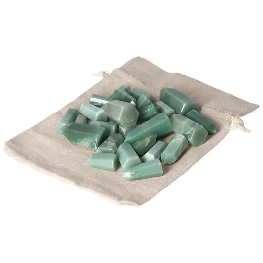 Mini Point Green Quartz stones, 0.5 KG, 20 PCS, displayed on a beige cloth bag, showcasing their light green hue and smooth finish.