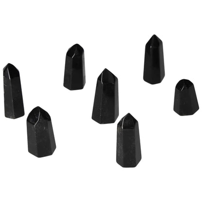 Mini Point Obsidian stones arranged on a white background, showcasing their powerful protective auras and negative energy absorption qualities.