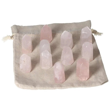 Mini rose quartz points on cloth bag, symbolizing love, compassion, heart healing, and emotional balance for heart chakra support.