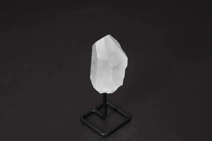 Natural Clear Quartz Point on modern stand, enhances energy and clarity, ideal for meditation and manifestation.