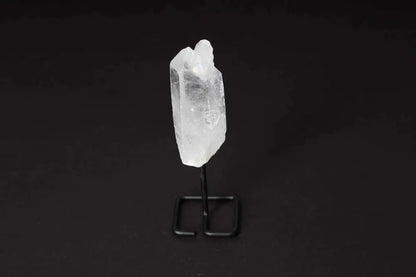 Natural Clear Quartz Point on stand for energy amplification and alignment, ideal for meditation and manifestation.