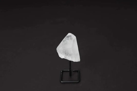 Natural Clear Quartz Point on Stand for energy alignment and meditation, elegantly displayed to amplify and illuminate space.