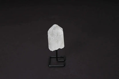 Natural Clear Quartz Point on Stand, ideal for energy amplification and clarity in meditation or decor.