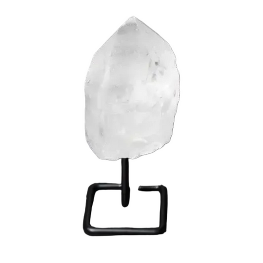 Natural clear quartz point on a modern stand, known as a Master Healer, amplifying energy for meditation and clarity.