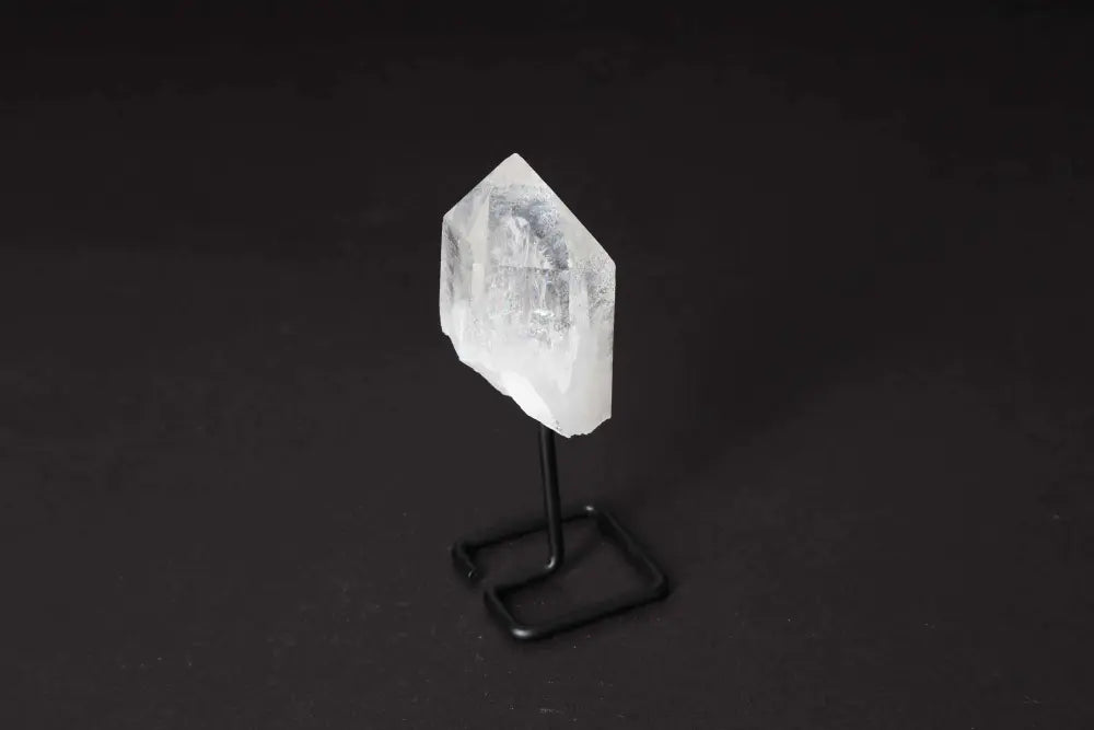 Natural Clear Quartz Point on Stand, ideal for meditation and energy work, amplifies clarity and intention, elegant home decor.
