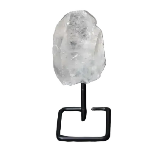 Natural Clear Quartz Point on modern stand, known as the Master Healer, enhances energy and clarity in meditation and energy work.