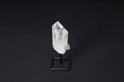 Clear Quartz Point on stand for energy amplification and clarity in meditation and manifestation.