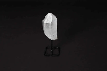 Natural Clear Quartz Point on modern stand, perfect for amplifying energy, clarity, and focus in meditation or energy work.