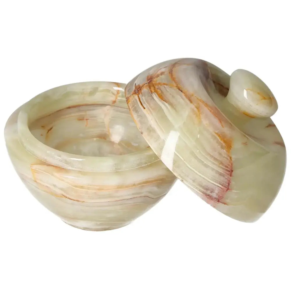 Onyx 10cm bowl with lid showcasing natural veining, refined craftsmanship, and elegant translucency for sophisticated décor enhancement.