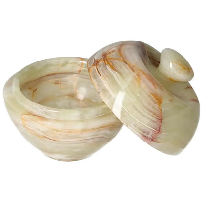 Onyx 10cm bowl with lid showcasing natural veining, refined craftsmanship, and elegant translucency for sophisticated décor enhancement.