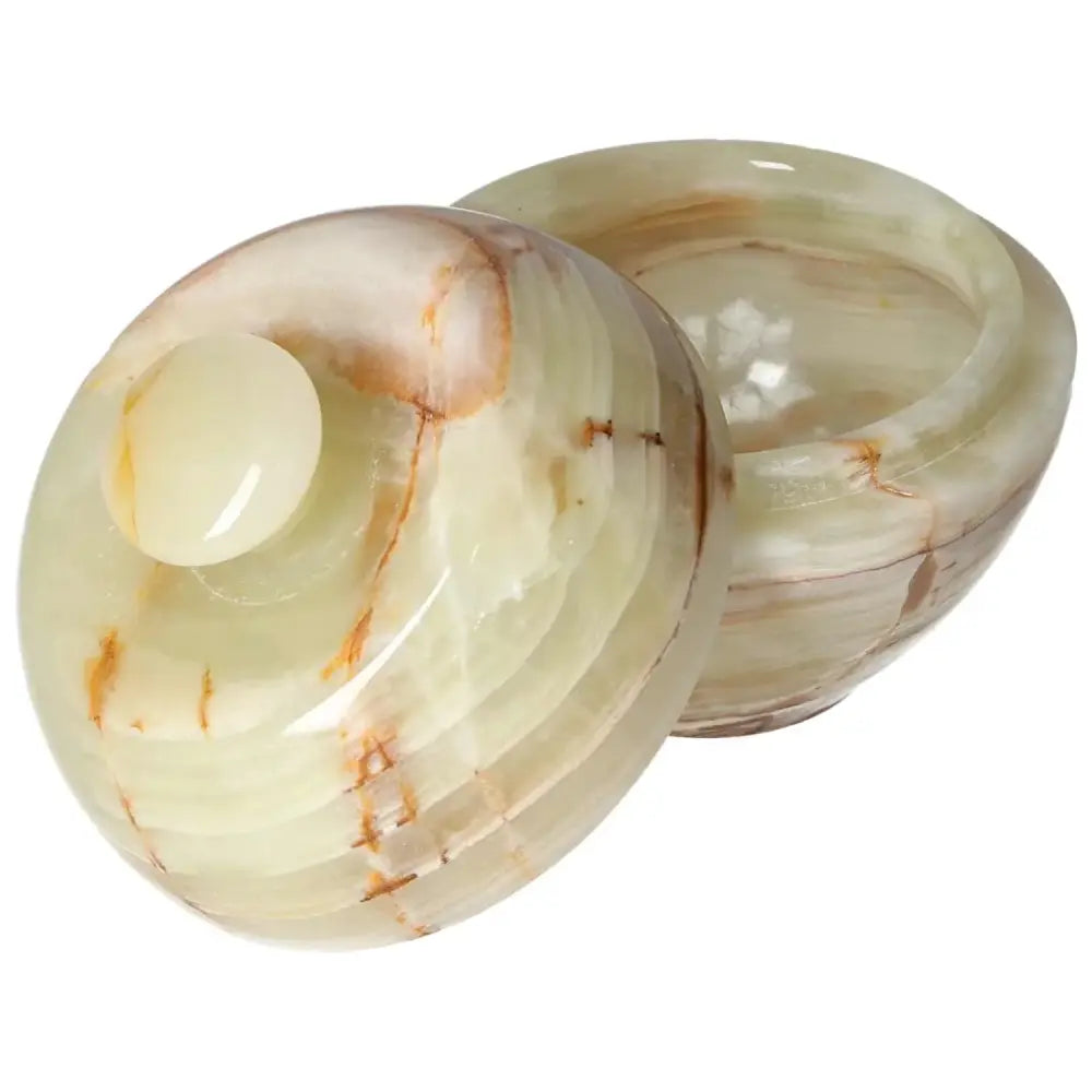 Elegant 10cm onyx bowl with lid showcasing natural veining and polished finish, perfect for adding a sophisticated touch to décor.