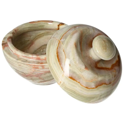 Onyx 10cm bowl with lid, showcasing unique veining and polished finish, perfect for adding elegance to home décor.