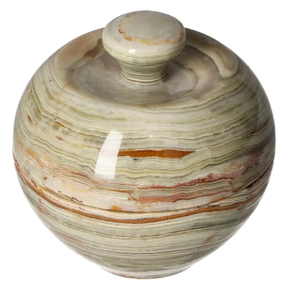 Onyx bowl with lid, showcasing elegant veining and smooth, polished finish, capturing light for a sophisticated décor accent.