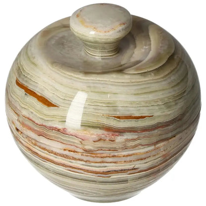 Onyx 10cm bowl with lid displaying natural veining and polished finish, adding elegance to home décor while reflecting light beautifully.