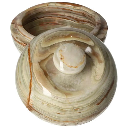 Onyx bowl with lid, featuring polished surface and unique veining, ideal for décor enhancement and luxury aesthetics.