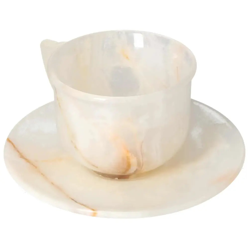 Exquisite off-white onyx coffee cup and plate set, highlighting unique natural patterns and polished finish, perfect for elegant decor.