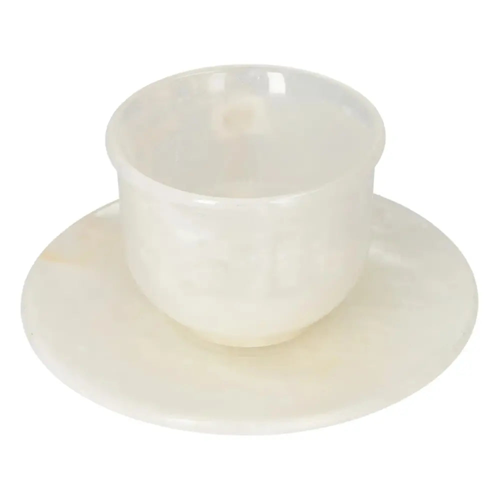 Elegant off-white onyx coffee cup and plate set showcasing natural beauty and unique patterns, perfect for elevating your coffee ritual.