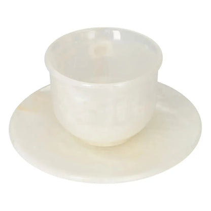 Elegant off-white onyx coffee cup and plate set showcasing natural beauty and unique patterns, perfect for elevating your coffee ritual.