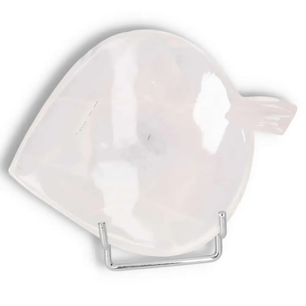 Onyx Rose Calcite Plate, a heart-shaped dish representing determination and self-discipline, displayed on a metal stand.