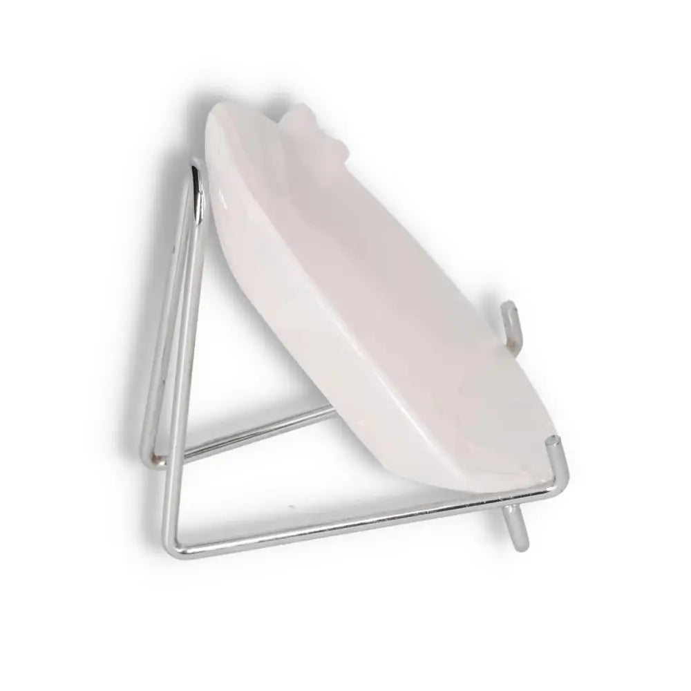 Onyx Rose Calcite Plate on a metal stand showcasing its sleek design and calming pink hue.