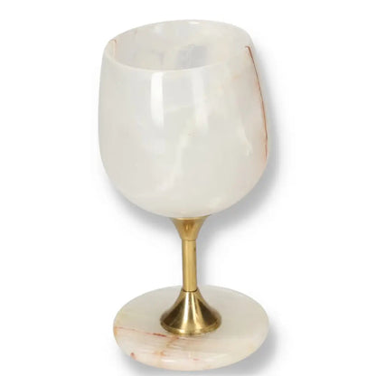 Exquisite onyx wine glass with a smooth, polished surface and unique veining, featuring a premium off-white finish and elegant design.