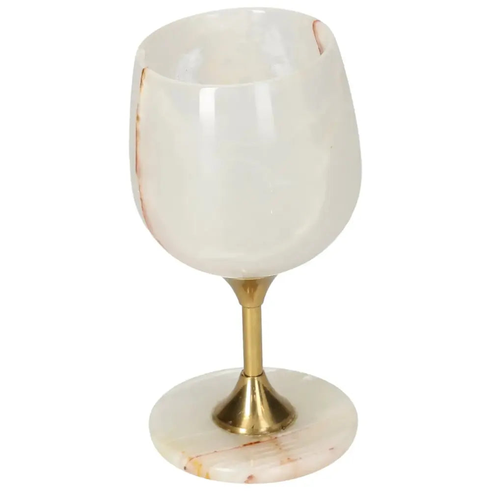 Elegant off-white onyx wine glass with natural veining and polished surface, featuring a gold-colored stem for enhanced sophistication.
