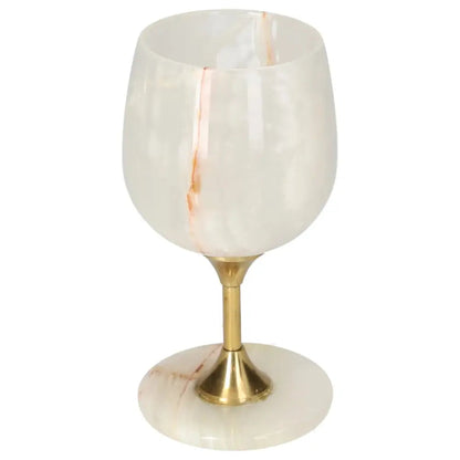 Elegant onyx wine glass with off-white tones and unique veining, featuring a polished surface and golden stem, perfect for sophisticated gatherings.