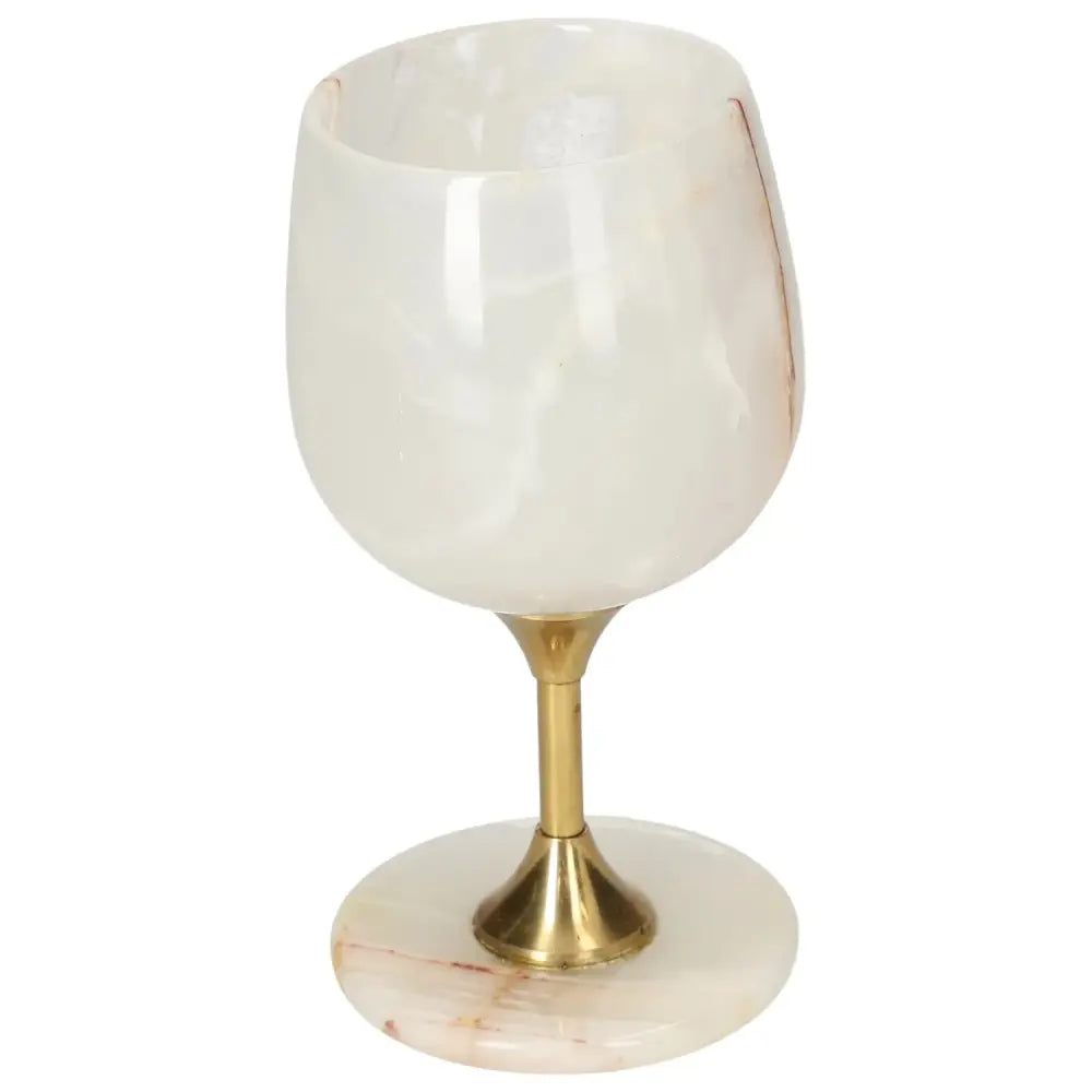 Elegant off-white onyx wine glass with gold stem, showcasing unique veining and polished surface for sophisticated drinking.