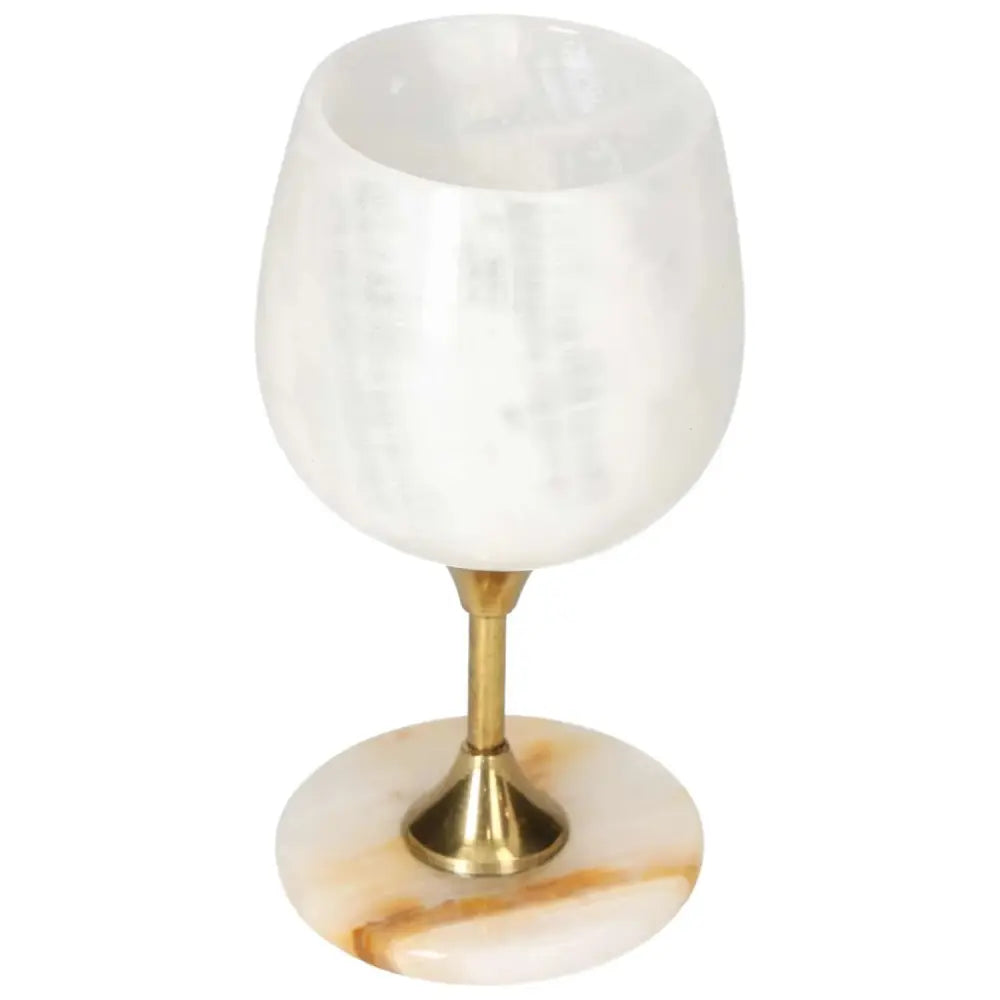 Elegant onyx wine glass with a polished off-white finish and unique veining, featuring a sleek gold stem perfect for fine dining occasions.