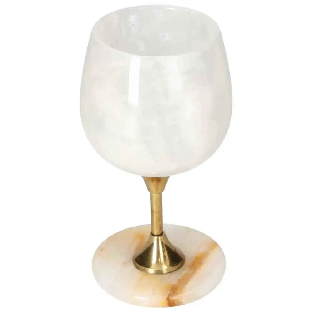 Elegant onyx wine glass with gold stem, showcasing unique veining and polished off-white surface for sophisticated drinking.