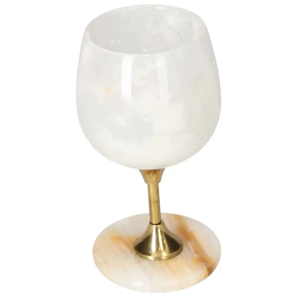 Elegant onyx wine glass with unique veining, polished off-white finish, and gold stem, perfect for sophisticated gatherings.