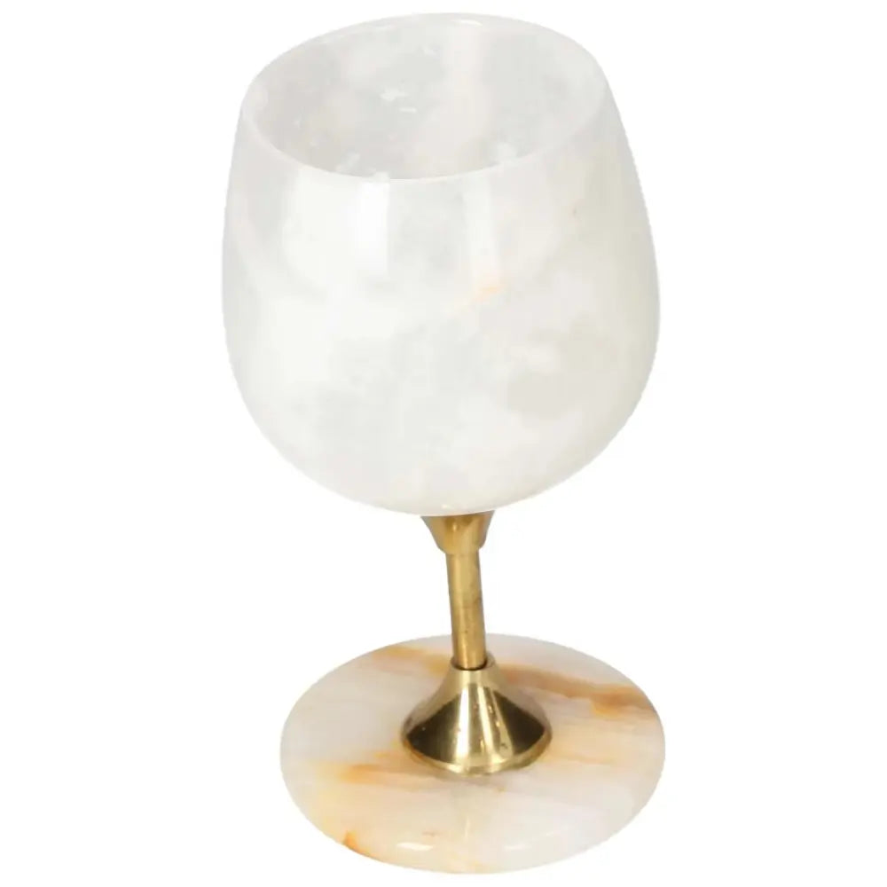 Exquisite onyx wine glass with unique color variations and a polished surface, showcasing luxury and natural elegance.