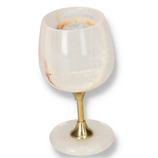 Elegant off-white onyx wine glass with unique veining and polished finish on a gold stem, perfect for refined occasions.