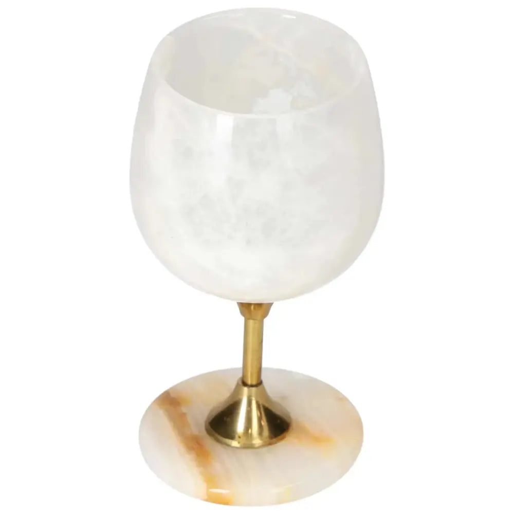 Exquisite off-white onyx wine glass with unique veining and gold stem, perfect for elegant occasions.