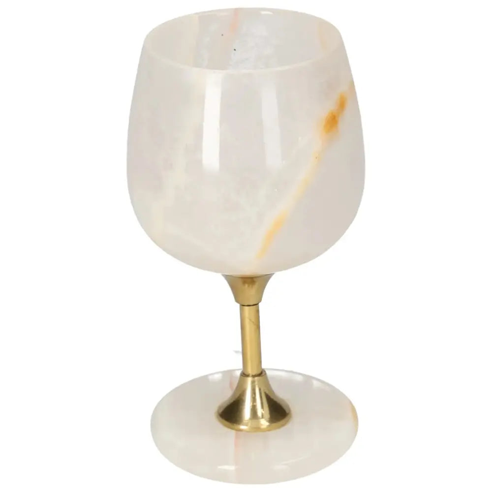 Elegant onyx wine glass with unique veining, featuring a polished surface and gold stem, perfect for sophisticated occasions.