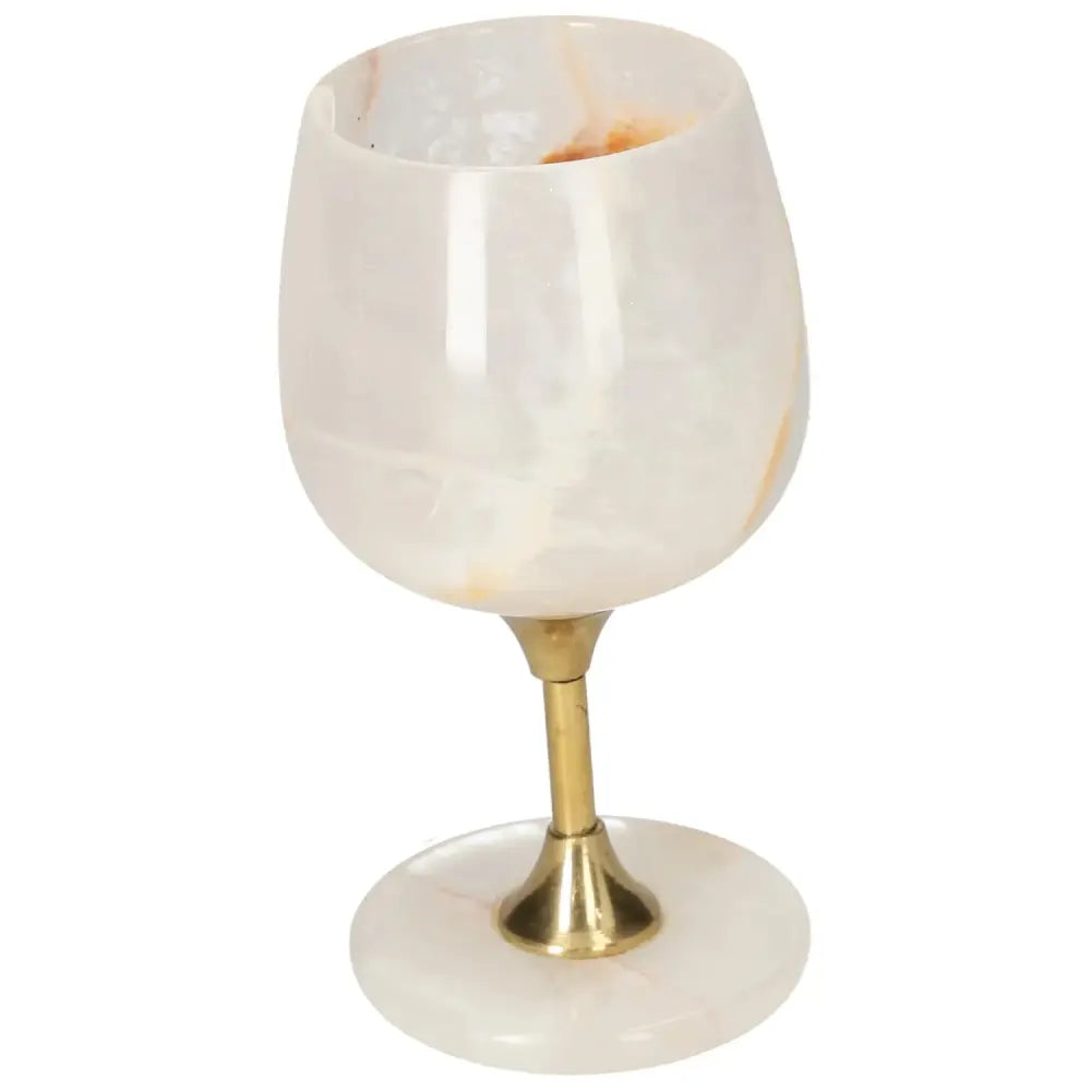 Elegant onyx wine glass with unique off-white veining and polished finish, perfect for sophisticated occasions.