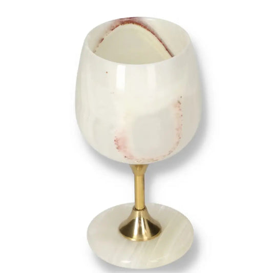 Exquisite onyx wine glass with unique veining and gold stem, showcasing elegance and sophistication for fine drinking occasions.