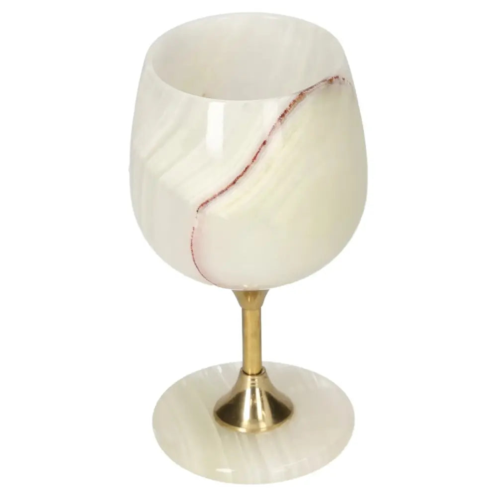 Exquisite onyx wine glass with unique off-white color veining and polished surface, featuring an elegant gold stem.