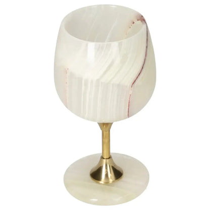 Elegant onyx wine glass with gold stem, showcasing unique veining and polished surface, perfect for sophisticated occasions.