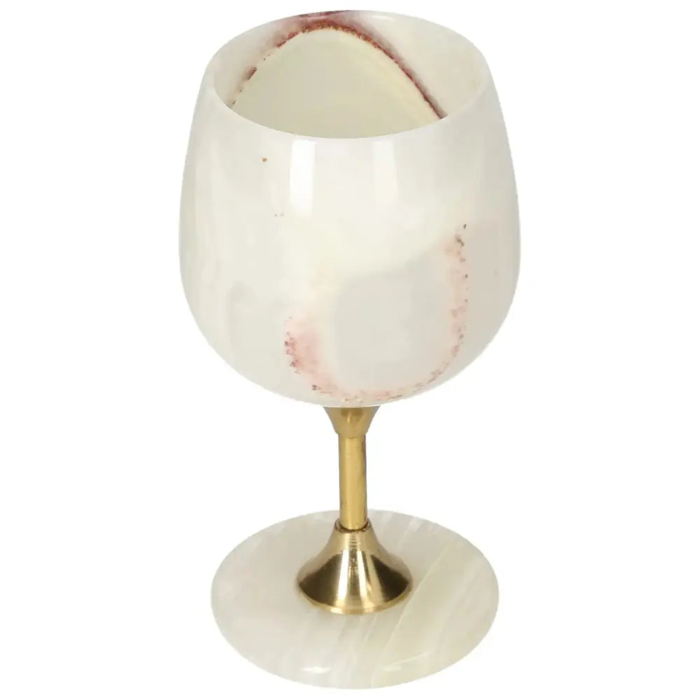 Elegant onyx wine glass with natural off-white variations and polished surface, perfect for sophisticated occasions.
