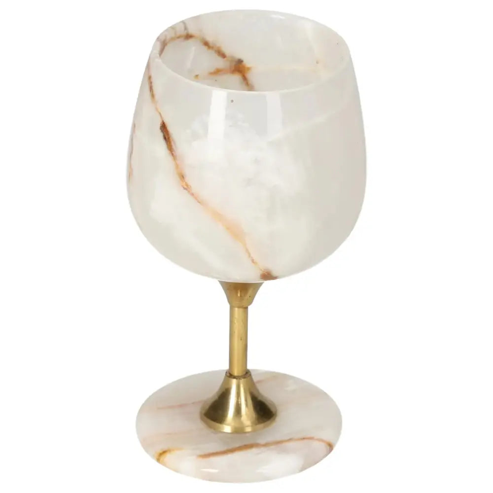 Elegant onyx wine glass with gold stem, showcasing natural veins and polished off-white surface, exuding sophistication and charm.