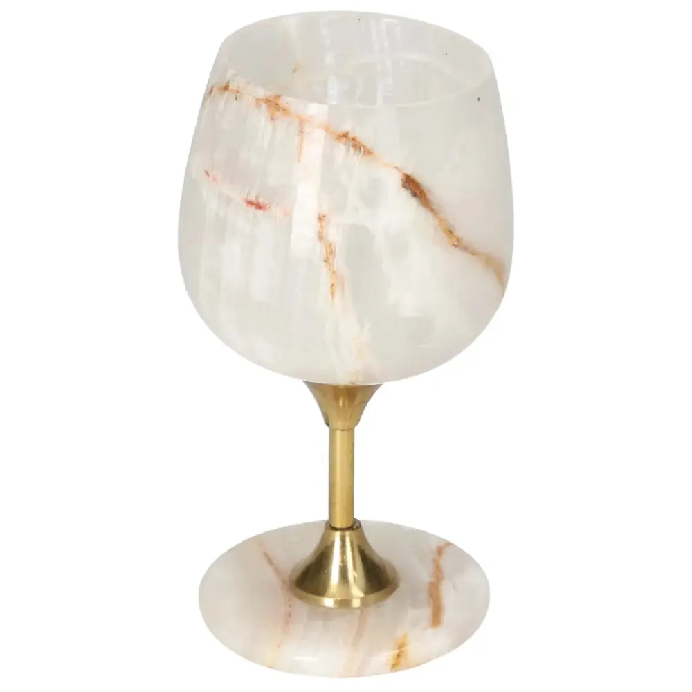 Elegant onyx wine glass with unique veining patterns, featuring a polished off-white finish and a sophisticated gold stem.