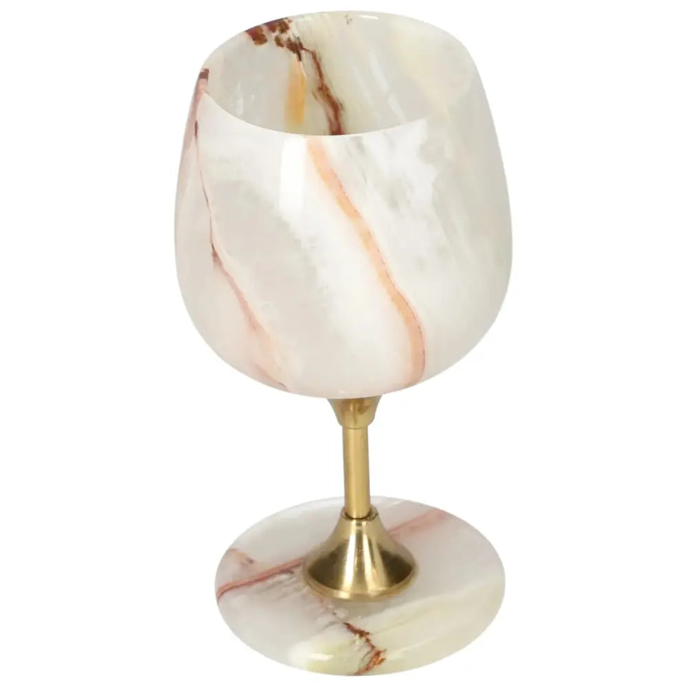 Exquisite off-white onyx wine glass with unique veining and a polished finish, adding elegance to fine drinking occasions.