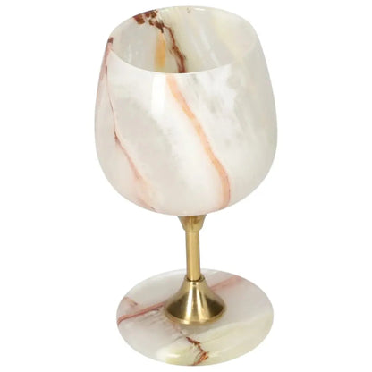 Exquisite off-white onyx wine glass with unique veining and a polished finish, adding elegance to fine drinking occasions.